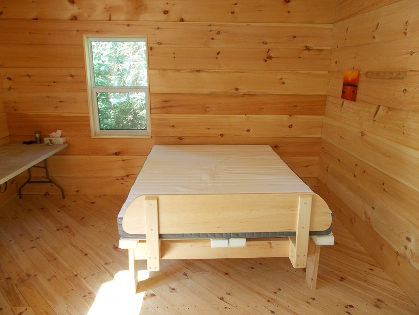 Queen-size metal-free bed with space to get in from either side